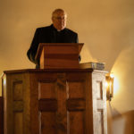 Pastor Brechter preaching at worship service